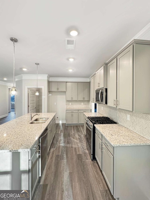5331 Tuscany Dr, Douglasville, GA 30135 - kitchen featuring ornamental molding, dark wood-style floors, gray cabinets, a sink, and stainless steel appliances
