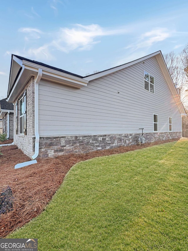 5331 Tuscany Dr, Douglasville, GA 30135 - view of home's exterior with a yard