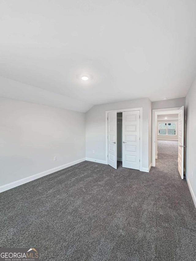 5331 Tuscany Dr, Douglasville, GA 30135 - interior space with baseboards, a closet, and dark carpet