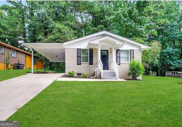 2930 Waters Rd, Atlanta, GA 30354 - view of front of house with concrete driveway, brick siding, a front yard, and a carport