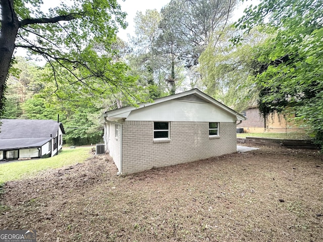 2930 Waters Rd, Atlanta, GA 30354 - view of side of home featuring central air condition unit and brick siding