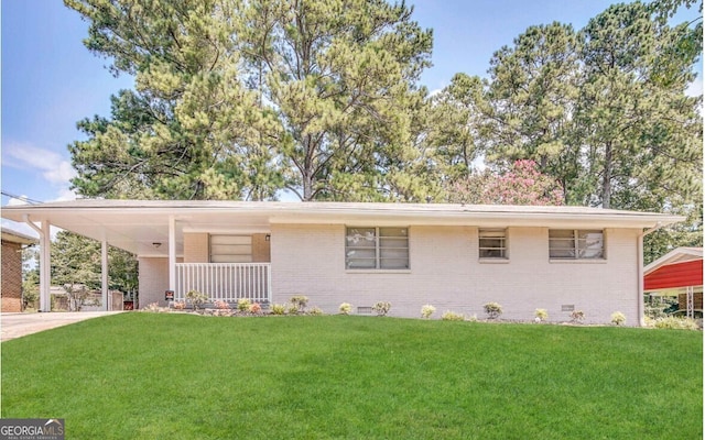 single story home with an attached carport, concrete driveway, a front yard, and brick siding