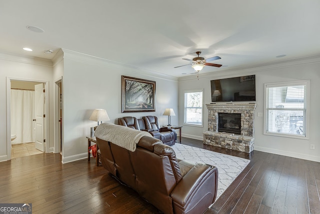 2225 Independence Ln, Buford, GA 30519 - living room with a ceiling fan, a fireplace, dark wood finished floors, and crown molding