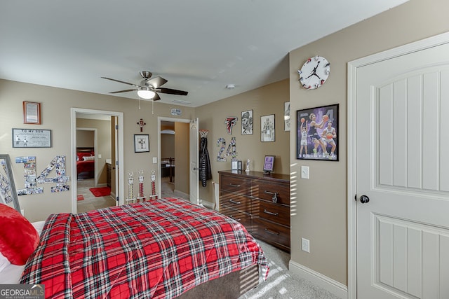 2225 Independence Ln, Buford, GA 30519 - carpeted bedroom with baseboards and ceiling fan