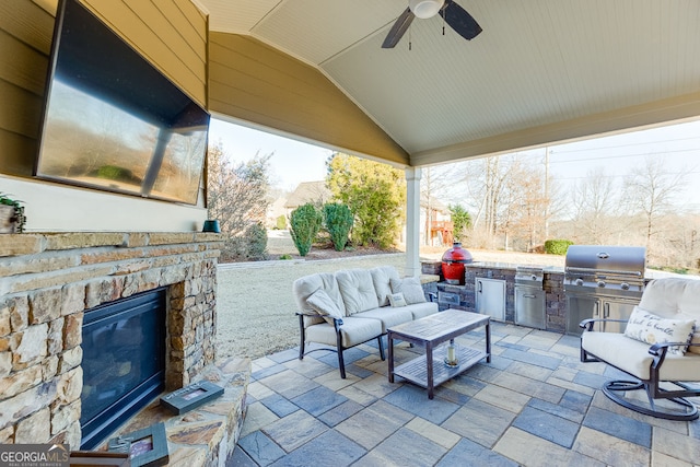 2225 Independence Ln, Buford, GA 30519 - view of patio with area for grilling, an outdoor living space with a fireplace, and a ceiling fan