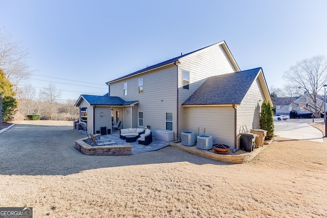 2225 Independence Ln, Buford, GA 30519 - rear view of property with an outdoor living space, a patio, and roof with shingles