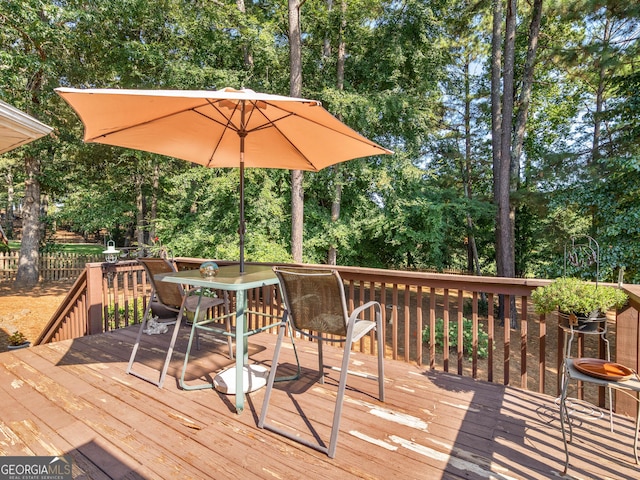 deck featuring outdoor dining area