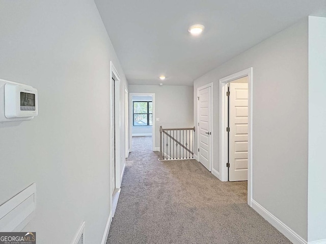 5321 Tuscany Dr, Douglasville, GA 30135 - corridor featuring baseboards, an upstairs landing, and carpet