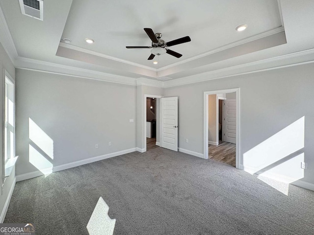 5321 Tuscany Dr, Douglasville, GA 30135 - unfurnished bedroom featuring crown molding, carpet flooring, a tray ceiling, and visible vents