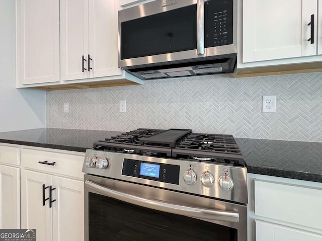 5321 Tuscany Dr, Douglasville, GA 30135 - kitchen with dark stone counters, white cabinetry, appliances with stainless steel finishes, and tasteful backsplash
