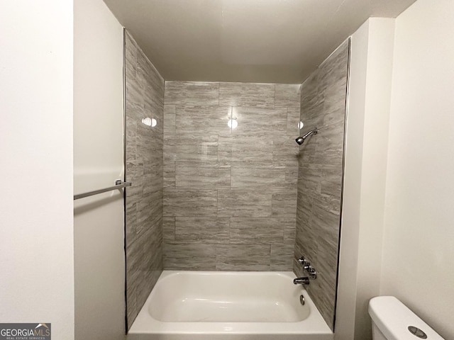 bathroom featuring  shower combination and toilet