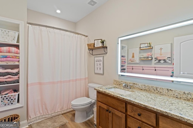 291 Higgins Rd, Flovilla, GA 30216 - bathroom featuring visible vents, vanity, curtained shower, wood finished floors, and toilet