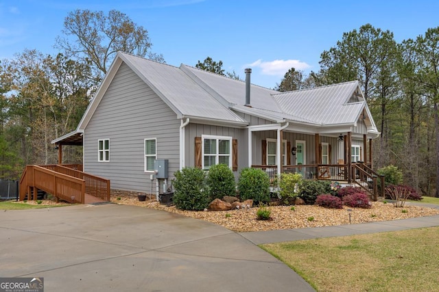 291 Higgins Rd, Flovilla, GA 30216 - view of home's exterior with stairs, board and batten siding, a porch, and metal roof