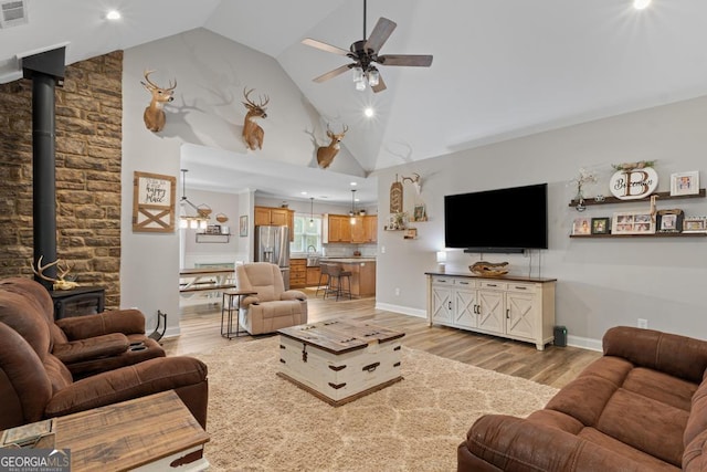 291 Higgins Rd, Flovilla, GA 30216 - living room with ceiling fan, a wood stove, light wood-style flooring, recessed lighting, and visible vents