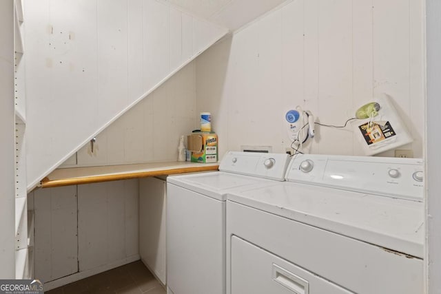 laundry area with laundry area, tile patterned flooring, and separate washer and dryer