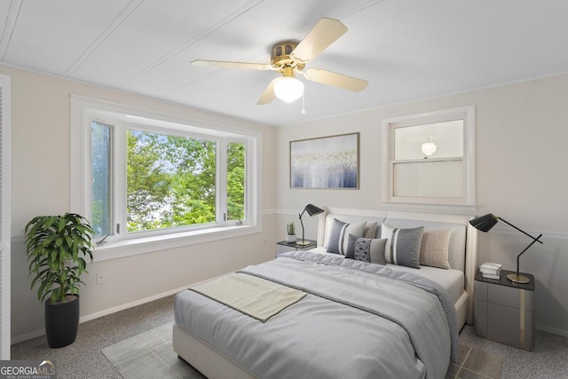 bedroom with baseboards, carpet flooring, and ceiling fan