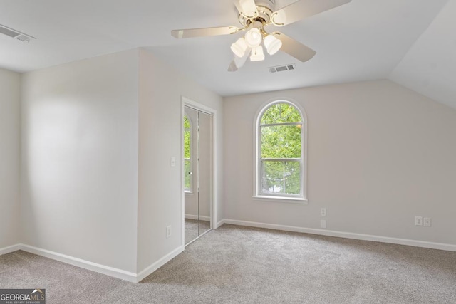 interior space featuring visible vents, carpet flooring, and baseboards
