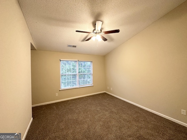 263 Coral Cir, Mcdonough, GA 30253 - empty room featuring ceiling fan, a textured ceiling, dark colored carpet, baseboards, and visible vents