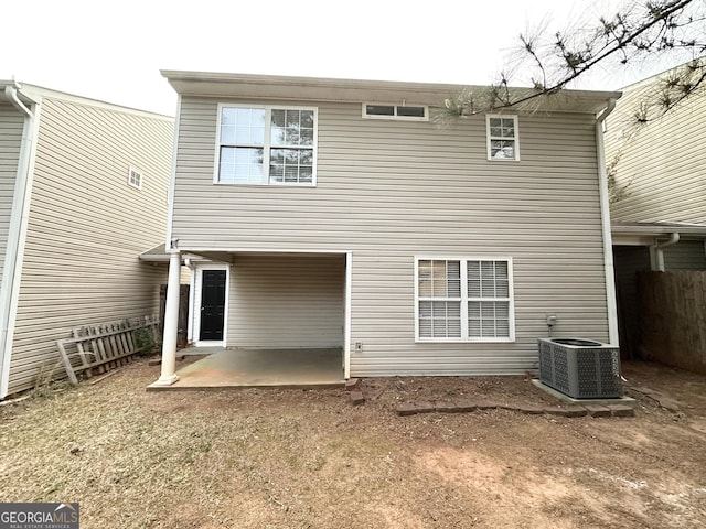 263 Coral Cir, Mcdonough, GA 30253 - back of property featuring central AC unit, a patio area, and fence