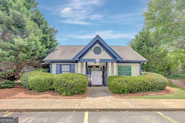 35 Wenham Ln, Sharpsburg, GA 30277 - view of front facade with a gate and stucco siding