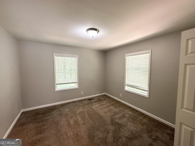 830 Mercury Dr, Atlanta, GA 30331 - empty room with dark colored carpet, baseboards, and visible vents