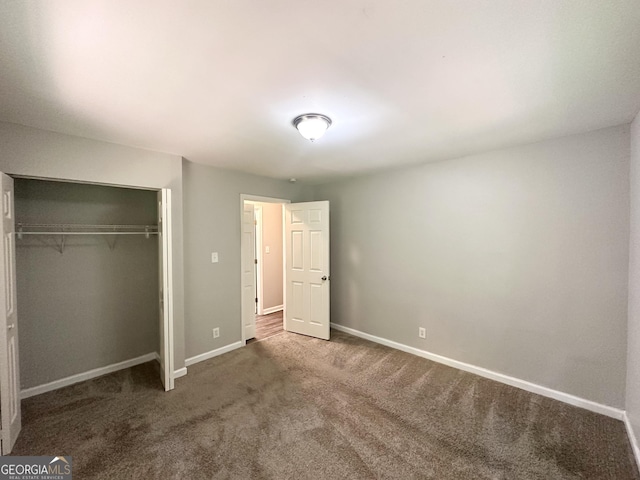 830 Mercury Dr, Atlanta, GA 30331 - unfurnished bedroom featuring carpet floors, baseboards, and a closet