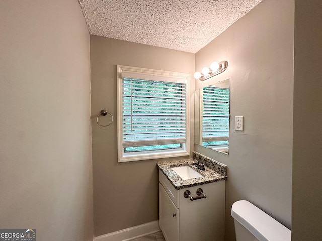830 Mercury Dr, Atlanta, GA 30331 - half bath with vanity, a textured ceiling, baseboards, and toilet