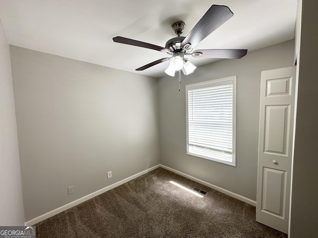 830 Mercury Dr, Atlanta, GA 30331 - unfurnished room featuring a ceiling fan, baseboards, visible vents, and dark colored carpet