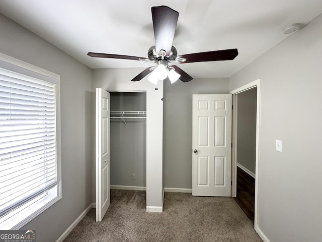 830 Mercury Dr, Atlanta, GA 30331 - unfurnished bedroom with carpet floors, baseboards, ceiling fan, and a closet