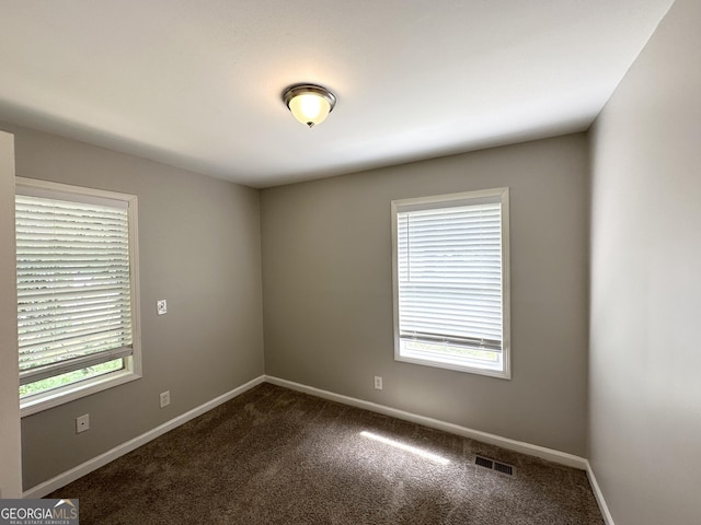 830 Mercury Dr, Atlanta, GA 30331 - empty room featuring visible vents, baseboards, and dark colored carpet