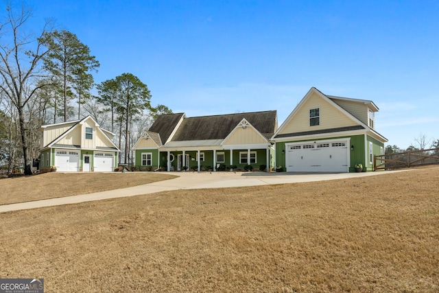 view of front of property featuring board and batten siding, driveway, an attached garage, and a shingled roof