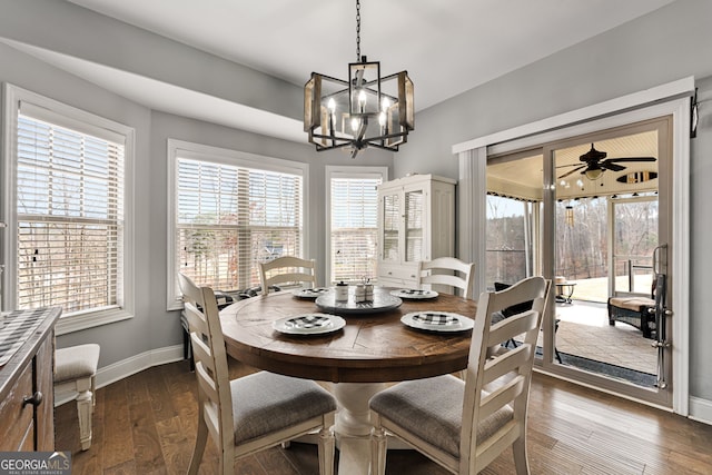 dining area featuring baseboards, healthy amount of natural light, and wood-type flooring