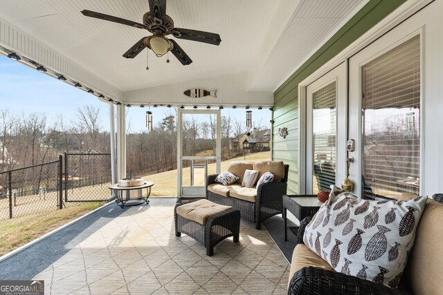 view of patio with fence, ceiling fan, and an outdoor living space