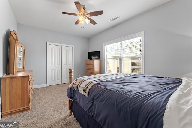 bedroom with carpet, a closet, baseboards, and ceiling fan