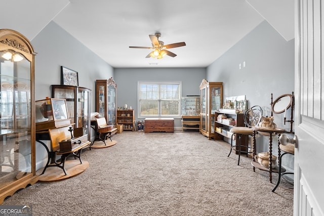 sitting room featuring carpet floors and ceiling fan