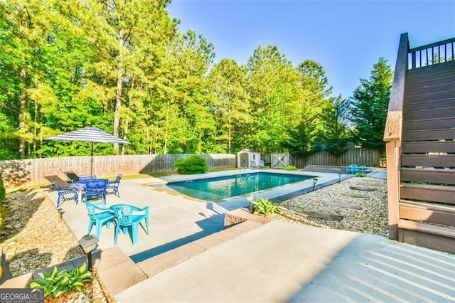 37 Wood Duck Pt, Jefferson, GA 30549 - view of swimming pool featuring stairway, a fenced backyard, a patio, and a storage shed