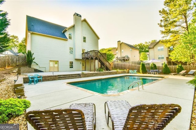 37 Wood Duck Pt, Jefferson, GA 30549 - view of pool featuring stairs, a patio, a fenced backyard, and a wooden deck