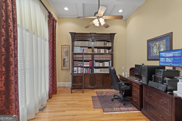 office area with light wood finished floors, a ceiling fan, baseboards, beamed ceiling, and coffered ceiling