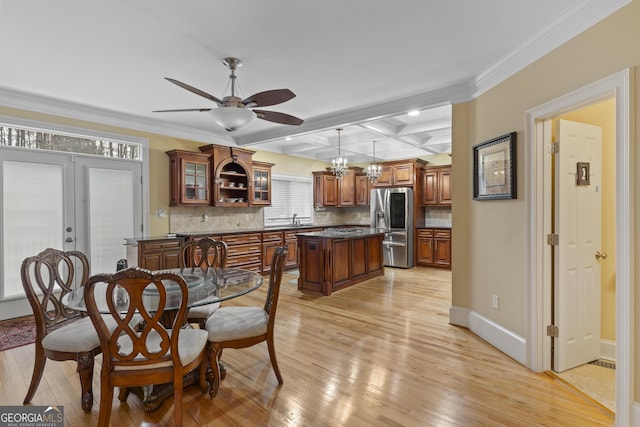 dining space with coffered ceiling, ceiling fan, french doors, and light wood finished floors