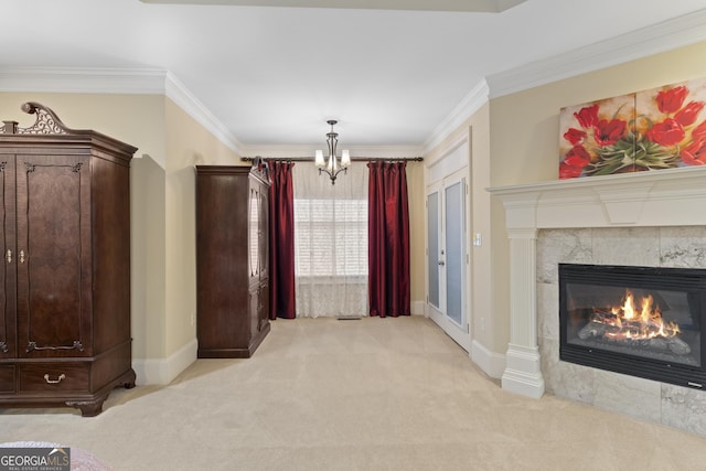 unfurnished living room featuring crown molding, a notable chandelier, light carpet, and a tile fireplace