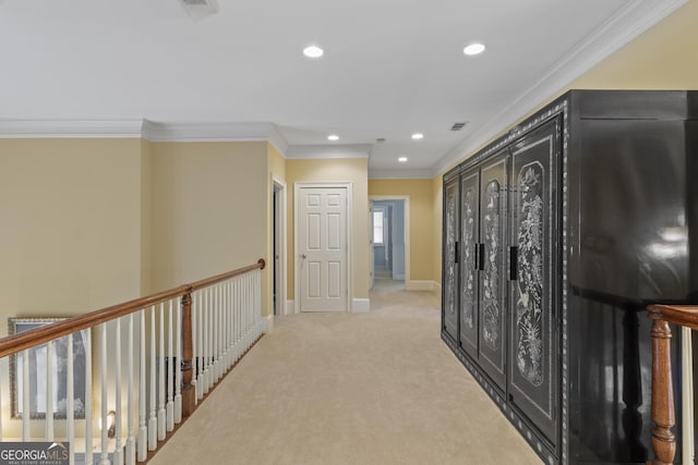 hallway featuring light carpet, recessed lighting, baseboards, visible vents, and ornamental molding