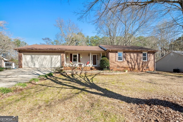 single story home with a garage, a front lawn, covered porch, brick siding, and concrete driveway