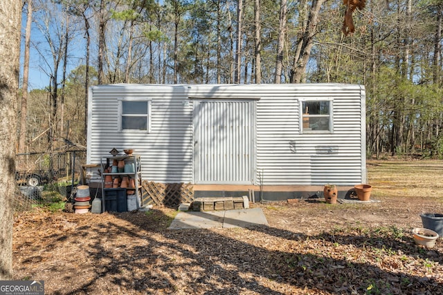 view of home's exterior featuring an outdoor structure