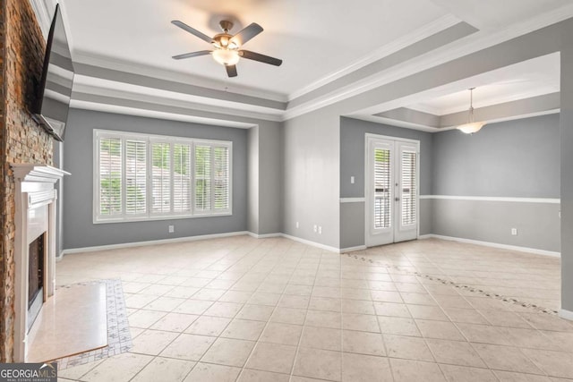 1502 River Green Dr NW Unit 1502, Atlanta, GA 30327 - unfurnished living room featuring tile patterned floors, plenty of natural light, a tray ceiling, and ceiling fan