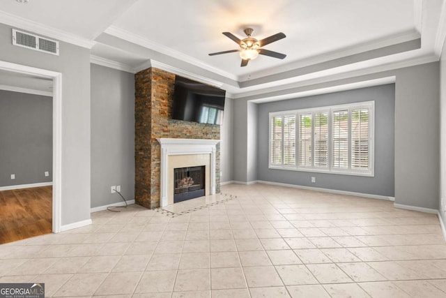 1502 River Green Dr NW Unit 1502, Atlanta, GA 30327 - unfurnished living room featuring crown molding, light tile patterned flooring, ceiling fan, a high end fireplace, and visible vents