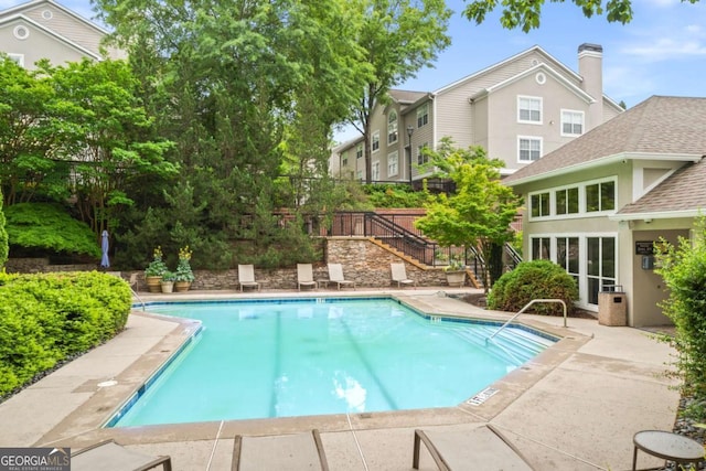 1502 River Green Dr NW Unit 1502, Atlanta, GA 30327 - pool featuring a patio area and stairway