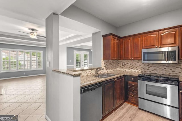 1502 River Green Dr NW Unit 1502, Atlanta, GA 30327 - kitchen featuring a sink, appliances with stainless steel finishes, light stone countertops, and backsplash