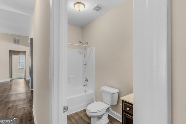 full bathroom featuring toilet, visible vents, wood finished floors, and vanity