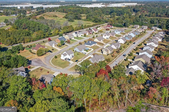 birds eye view of property with a residential view