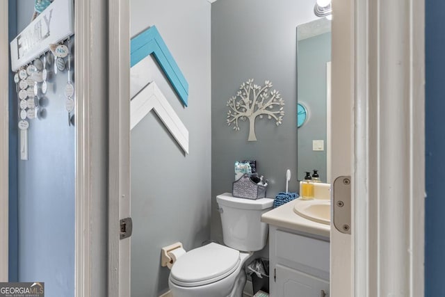 half bath with toilet and vanity